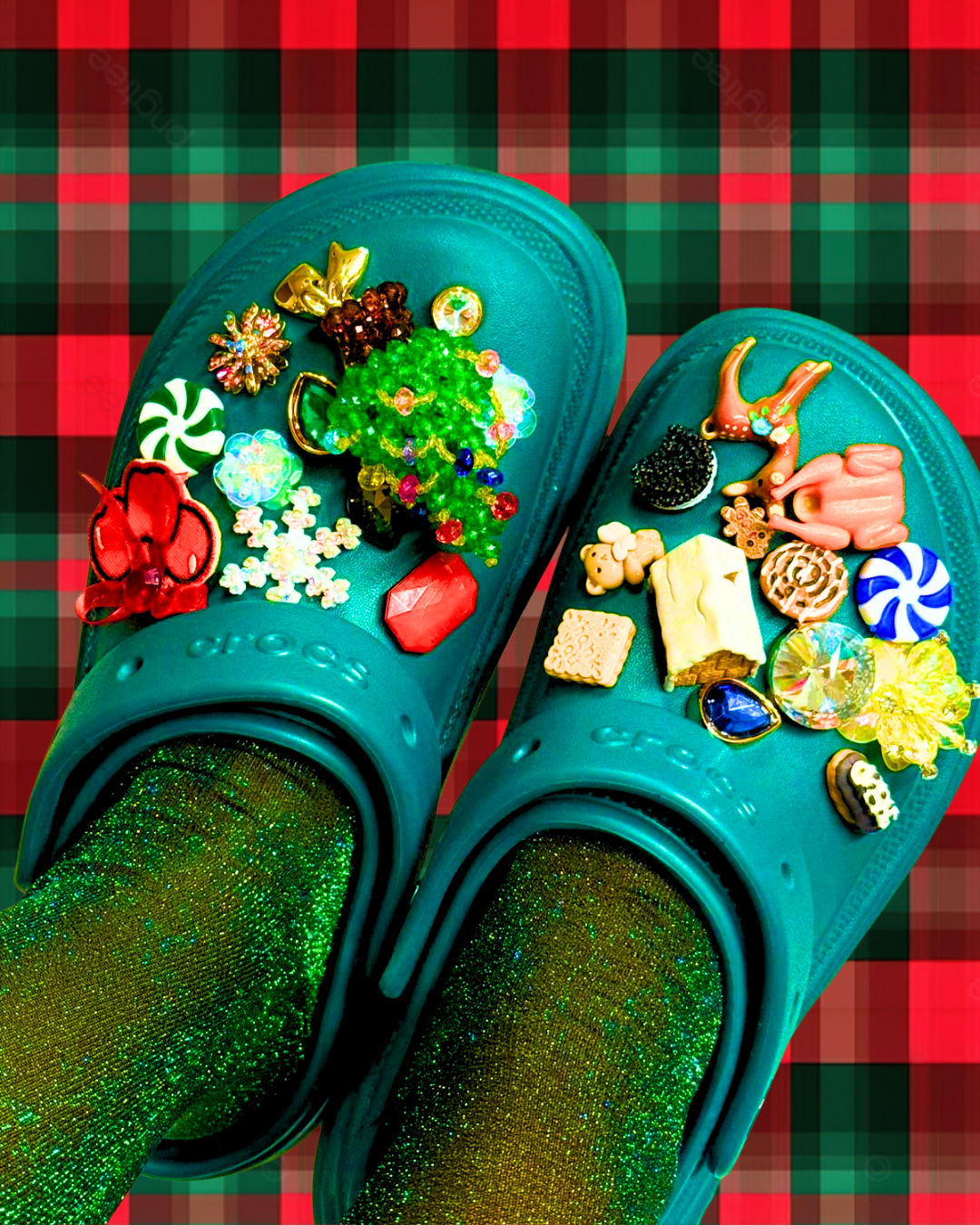 Teal Crocs with decorative christmas jibbitz charms on a red and green plaid background
